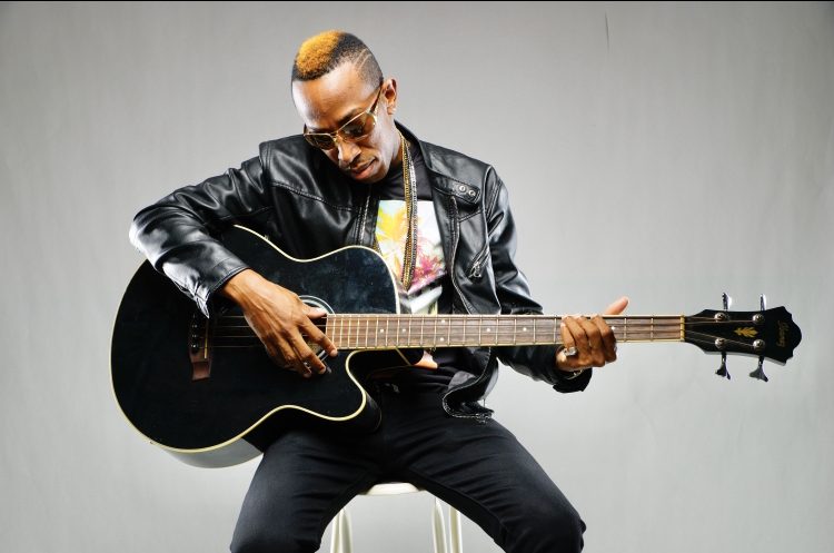 Portah playing guitar